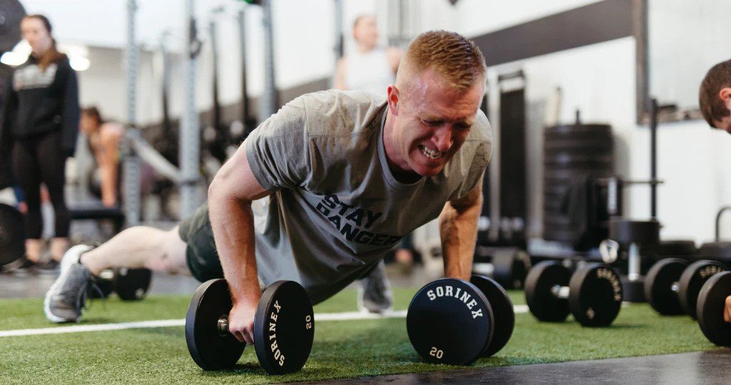 A focused athlete pushing through a challenging workout, symbolizing mental toughness and resilience.